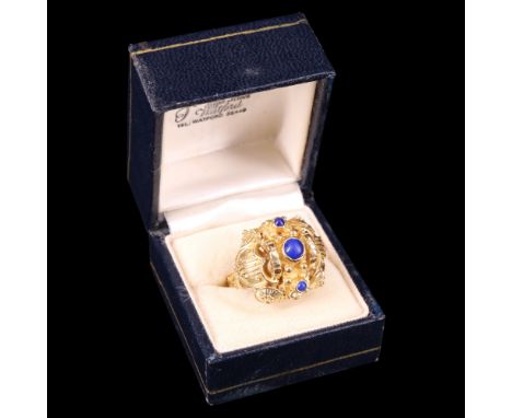 An impressive and substantial Greek lapis lazuli and 18 ct yellow metal ring, comprising a blue mineral cabochon bezel-set wi