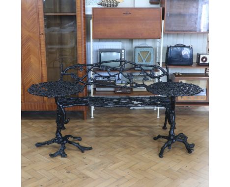 A cast-iron rustic design garden bench and tables, believed Coalbrookdale, bench 132 cm wide, tables 60 cm x 70 cm high
