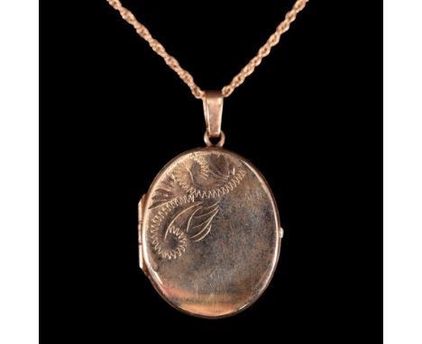 A vintage 9 ct gold oval locket pendant suspended on a 9 ct yellow metal fine rope-link neck chain, 40 cm, 23 mm excluding ba
