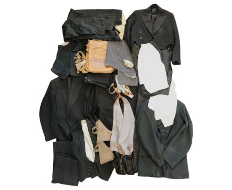 A large group of late 19th / early 20th Century men's clothing including two black three-piece suits, a tailcoat, a Victorian