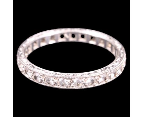 A vintage white-stone and 9 ct (white coloured) yellow metal eternity ring, each round-cut stone of approx 1.5 mm diameter pe