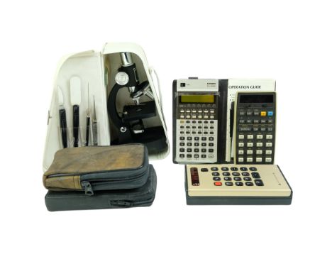 Vintage Advance 88, Casio FX-502P and Hewlett Packard electronic scientific calculators, together with a Greenkat student's m
