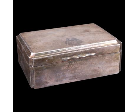 An Art Deco influenced silver table cigarette box, having re-entrant corners and finely engine-turned overall, the lid having