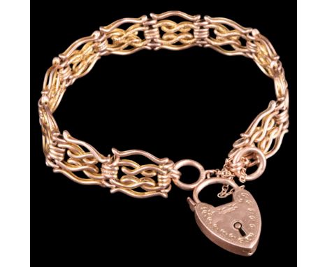 An early 20th Century 9 ct gold scroll-gate-link bracelet, having a padlock clasp, approx 18 cm, 16.3 g, (one cross-pin sligh