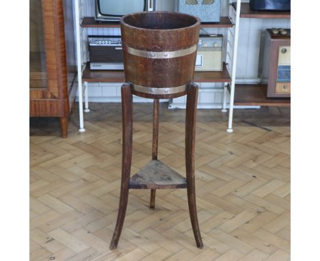 A coopered oak plant stand by R A Lister &amp; Co Ltd of Dursley, circa 1940s, 31 cm x 97 cm 