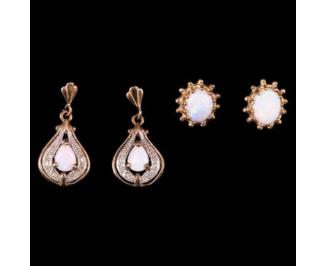 Two pairs of vintage opal and yellow metal earrings, one comprising oval cabochons bezel-set and edged by jewels, the other p