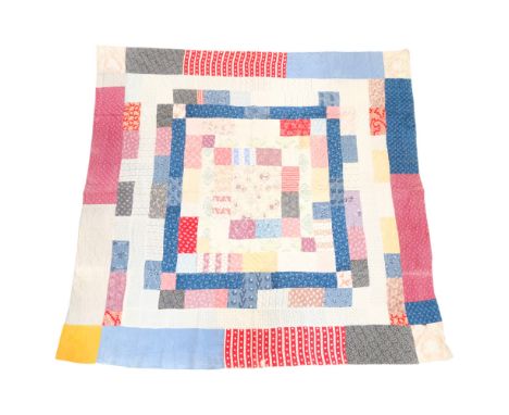 An early 20th Century hand-stitched patchwork quilt or throw, approx 2 m x 2 m 
