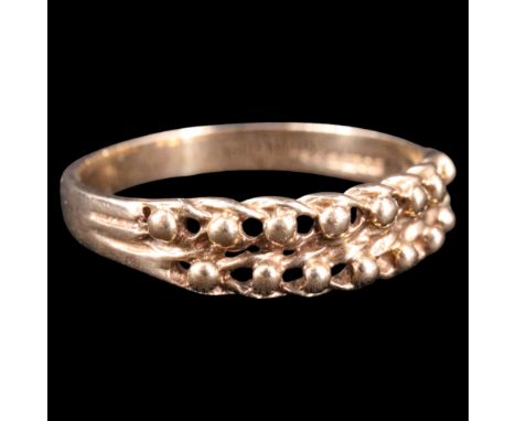 A 1980s 9 ct gold finger ring, comprising repeating wishbones and jewels between the reeded shoulders of a 9 ct gold shank, N