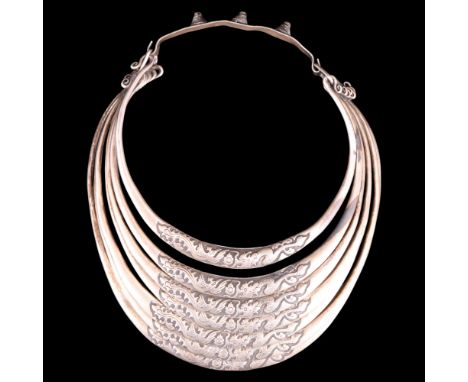 A Southern Chinese Miao seven-ring Paktong / nickel alloy necklace, decorated in depiction of dragons and flaming pearls