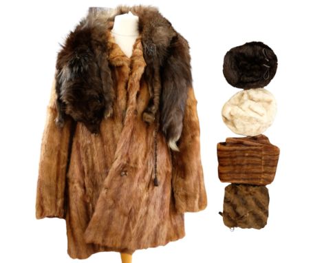 A small group of vintage furs comprising a fox fur coat, two hats, a mink fur muff with integral purse and Bakelite cuff bang