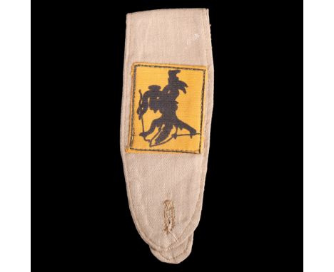 A British Troops in Siam formation sign attached to a khaki drill epaulette