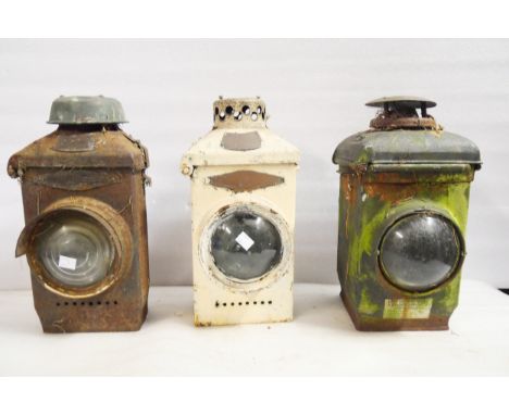 Two Adlake No. 22 signal lamps and one Adlake non-sweating signal lamp in unrestored condition. 38cm H.