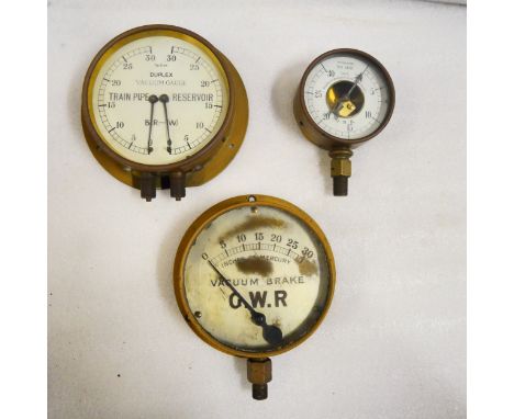 Three vacuum gauges. One reportedly removed from a GWR 5700 class pannier tank after its service with London Transport as det