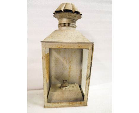 An LMS station platform lamp with reservoir - missing front glass panel. Note attached stating the lamp came from Barnwell st
