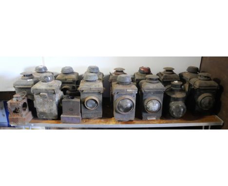 A collection of 12 signal lamps together with tree signal lamp burners. 