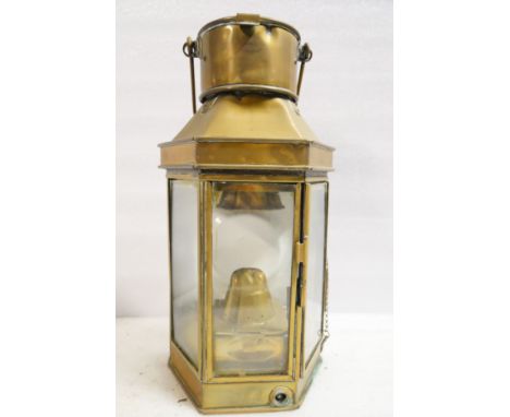 A Griffiths &amp; Son maritime bulkhead brass lamp with original burner. Maker's stamp and dated 1911. 40cm H.&nbsp;