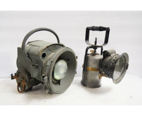 A BRC vehicle headlamp (25cm H) and a hand lamp (25cm H).