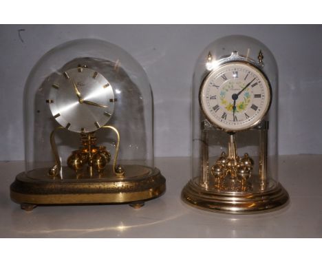 Glass dome mantle clock together with a anniversary clock