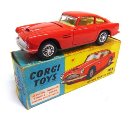 A CORGI NO.218, ASTON MARTIN D.B.4  red, with accessory pack spoke stickers to hubs, excellent condition, boxed, with Model C