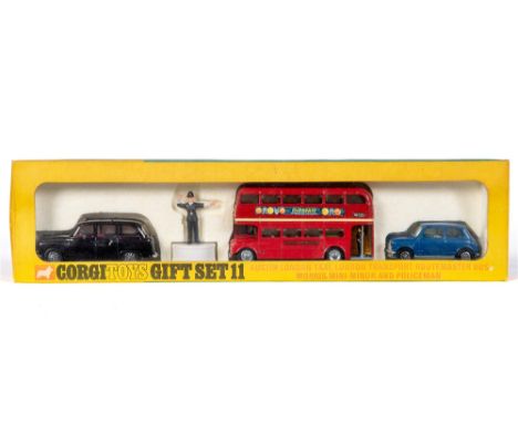 A CORGI GIFT SET NO.11, AUSTIN LONDON TAXI, LONDON ROUTEMASTER BUS, MORRIS MINI-MINOR AND POLICEMAN  near mint (Mini with pat