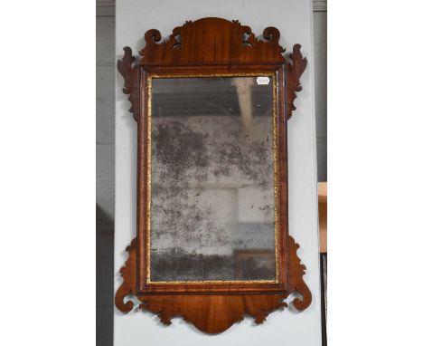 A Georgian Fret Cut Mirror, with original distressed mirror plate, 47cm by 78cm
