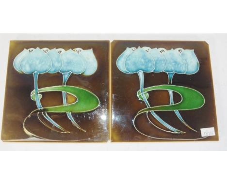 Pair Art Nouveau English ceramic tiles figural blue lotus flower and leaf decoration, marked ' England'  verso, (chips to 2 c