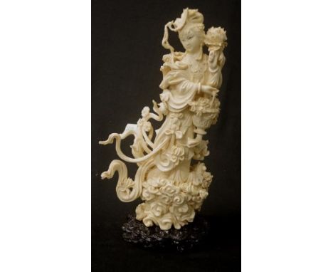 Large vintage carved ivory figure of a lady holding flowers, 29cm high.NB this item may not be exported.