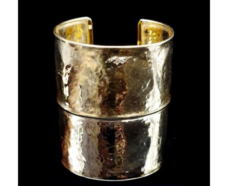 14ct yellow gold hammered cuff bangle marked 14kt Italy. Approx 34.9 grams, 58mm inside width.