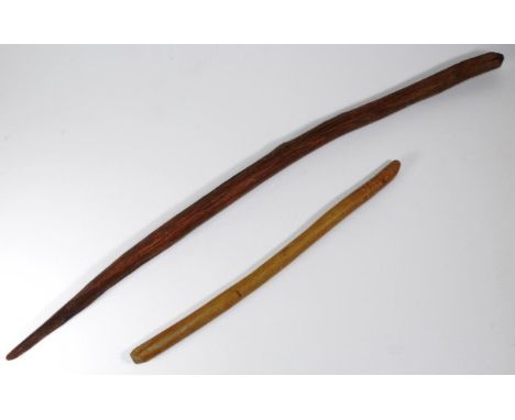 Two aboriginal sticks comprising of a Northern Territory aboriginal digging stick with wear from use and numerous age cracks,