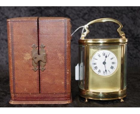 French brass cased carriage clock with key in leather covered carry case, (height 15cm approx, including handle extended). (C
