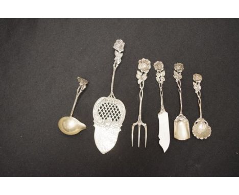 Six various Dutch silver utensils all stamped 835, comprising of 2 sugar spoons,butter knife, sauce ladle, cake slice and a p