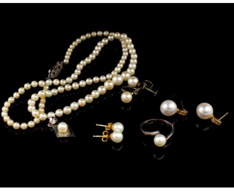 A group of cultured pearl jewellery includes a vintage graduated necklace with silver clasp, a silver ring marked S M, stud e