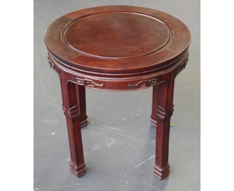 Chinese rosewood round occasional table with Greek key style and scroll carving, 55cm diameter, 56cm high approx