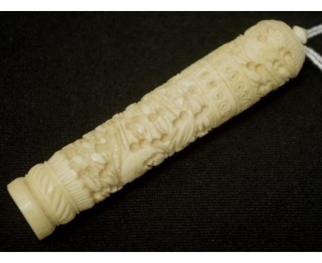 Eastern carved ivory needle case carved bird and blossom decoration, (length 9cm approx). NB This item may not be exported.