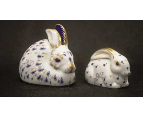 Two Royal Crown Derby Rabbit paperweights each with button to base, in original packaging, (height 5cm, and 7.5cm approx).