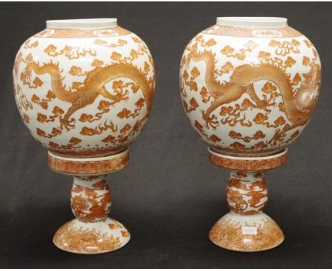 Pair Qing Chinese ceramic candle table lanterns each with iron red dragon decoration to base, (1 base with crack internally),