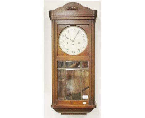 Vintage Junghans Germany wood cased wall clock wood cased, carved pediment, key and pendulum available, (height 78cm approx).