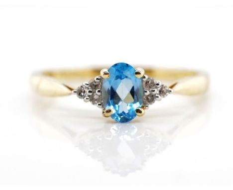 Topaz and diamond set 14ct yellow gold ring marked 14k. Approx weight 1.44 grams, ring size N-O