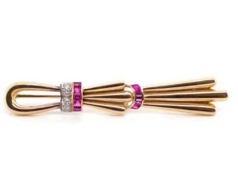 Ruby and diamond set 14ct rose gold brooch By Gazdar. Approx weight 14.2 grams weight