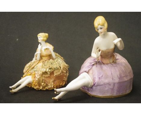 Two good German pin-cushion half dolls both with raised hands.