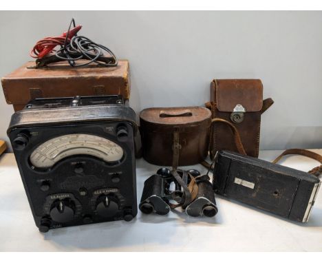 A Universal Avameter together with a Houghton Butcher camera and a pair of J.A O'Donohoe binocularsLocation: 