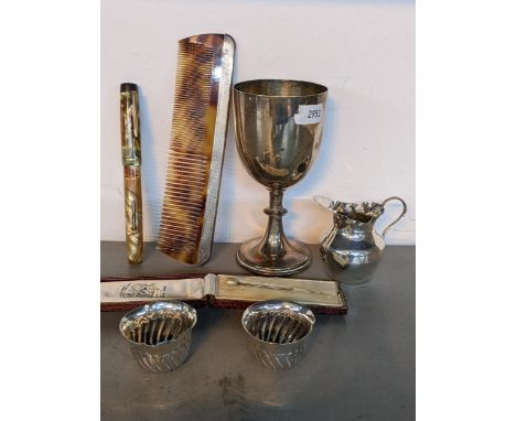 A mixed lot to include sliver miniature jug and bowls, silver plated trophy, tortoiseshell combe with silver mounts and a cas