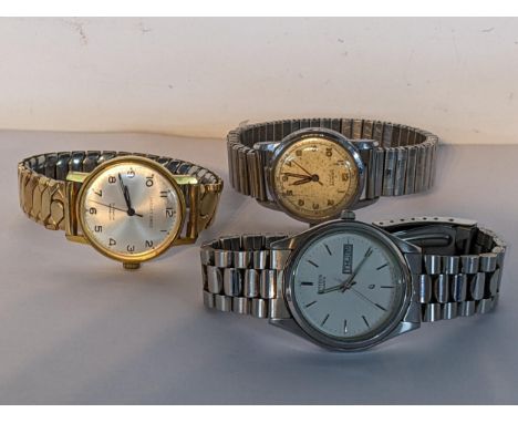 A group of three gents wristwatches to include a stainless steel Citizen Eco Drive, gold plated Jaquet Droz and a vintage man