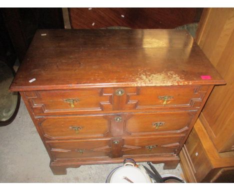 A late 17th/early 18th century oak chest of three graduated drawers, rectangular two plank top with moulded edge, the drawers