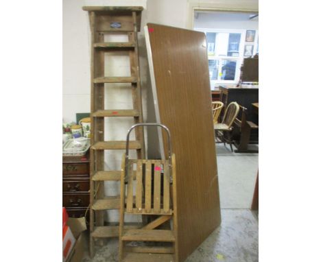 A Stephens &amp; Carter Ltd folding wooden ladder, a smaller folding ladder and a paste table with folding legs 