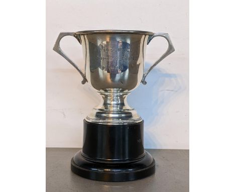 A silver twin handled trophy with inscription, dated 1938, hallmarked Birmingham, with stand, 72.2g, Location: 