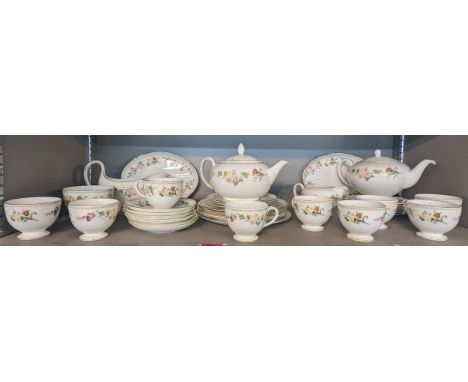 A Wedgwood Mirabelle pattern part tea and dinner service, comprising of teapots, cups and saucers, plates, a sauce boat and o
