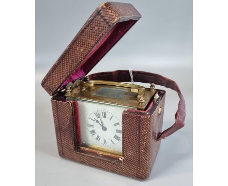 19th Century brass and enamel French carriage clock with Roman numerals in fitted original tooled leather case with key.(B.P.