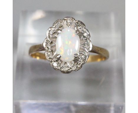 9ct gold opal and white stone dress ring.  Size M1/2.  1.8g approx.  (B.P. 21% + VAT) 