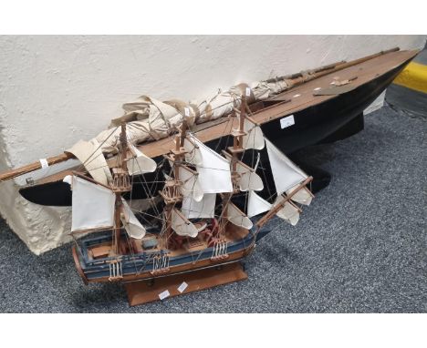 Modern model ship, HMS Endeavour together with a large vintage pond yacht, in distressed condition. (2) (B.P. 21% + VAT)  Ima